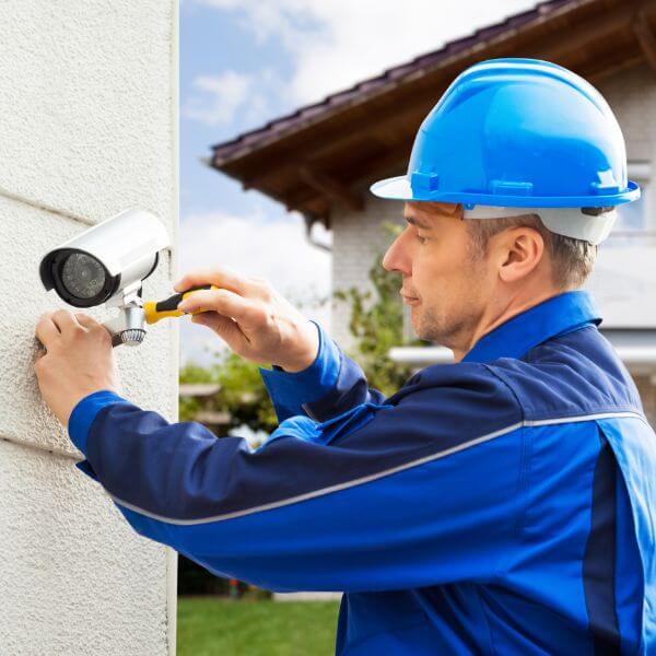 Home Security Guys technician performing home security camera repairs in Brisbane, adjusting outdoor CCTV camera. Home Security Guys technician performing home security camera repairs in Brisbane, adjusting outdoor CCTV camera.